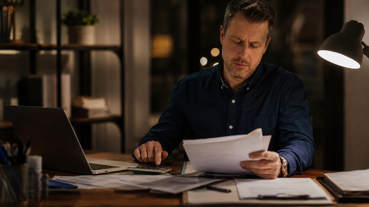 Business owner reviewing merchant cash advance relief options with a specialist